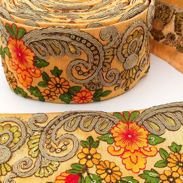 Peach Art Silk Fabric Trim With Orange, Green, Red And Gold Floral Embroidery